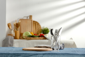 Spring table in the kitchen with the rays of the morning sun and kitchen attributes 