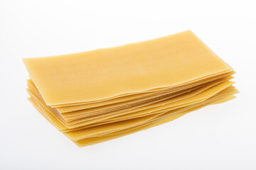 Uncooked lasagna sheets isolated on white