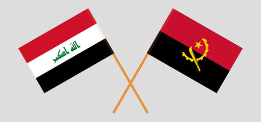 Crossed flags of Iraq and Angola. Official colors. Correct proportion