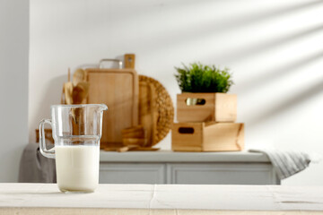 Spring table in the kitchen with the rays of the morning sun and kitchen attributes 