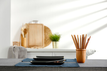 Spring table in the kitchen with the rays of the morning sun and kitchen attributes 