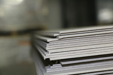 The gray cardboard that comes with the pallets used to make boxes in the printing house. selective focus is used.