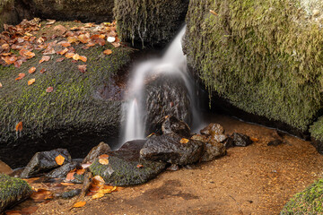 small waterfall between rocks