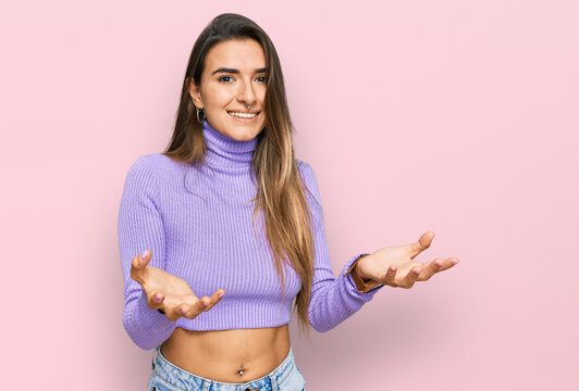 Young hispanic woman wearing casual clothes smiling cheerful offering hands giving assistance and acceptance.