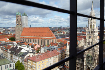 "Frauenkirche" Church of Our Lady in Munich and the new city hall in the cut. Bavaria, Germany. After the Second World War the church was rebuilt with the help of the USA. 