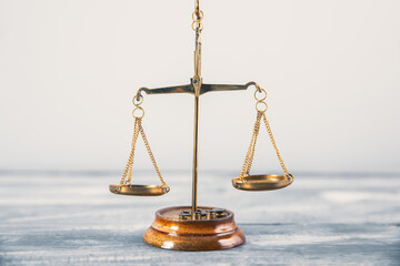 Scales of justice on table