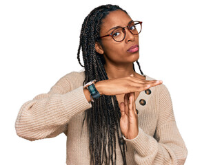 African american woman wearing casual clothes doing time out gesture with hands, frustrated and...