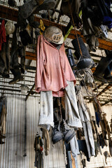 Fototapeta na wymiar Mining clothes hung in a chain hook locker room.