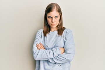 Beautiful caucasian woman wearing casual clothes skeptic and nervous, disapproving expression on...