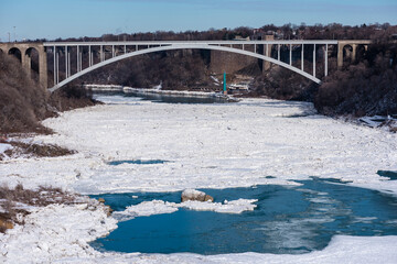 The Rainbow bridge spans the frozen Niagara River in Niagara Falls.