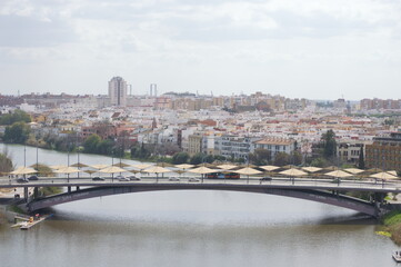 Fototapeta premium Aerial view of Triana an the river Guadalquivir, Seville, Spain