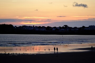 Fototapeta na wymiar Dramatic sunset on the beach of Saint Gilles Croix de Vie in France