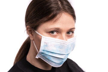 Beautiful young woman posing with mask,