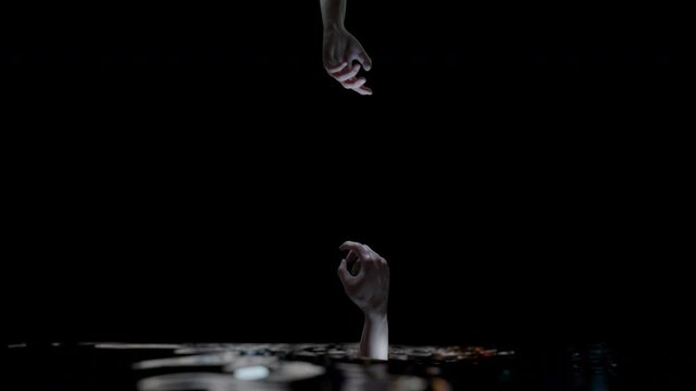 Drowning arm hand reaching out for help and connect with alpha.