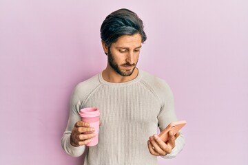 Young hispanic man using smartphone and drinking a cup of coffee depressed and worry for distress, crying angry and afraid. sad expression.