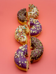 row of halved donuts on colorful background