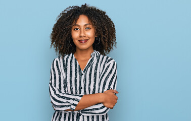 Young african american girl wearing casual clothes happy face smiling with crossed arms looking at the camera. positive person.