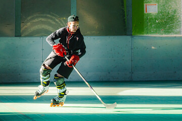 Inline hockey skating, young man skating inline hockey practice, off ice hockey practice
