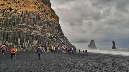 people walking on the beach