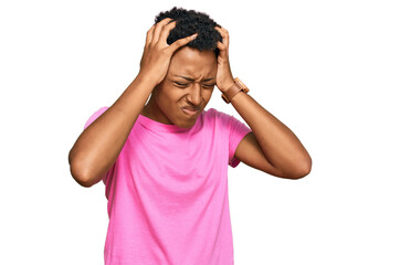 Fototapeta premium Young african american woman wearing casual clothes suffering from headache desperate and stressed because pain and migraine. hands on head.