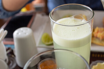 lemonade in a glass tumbler on a restaurant table