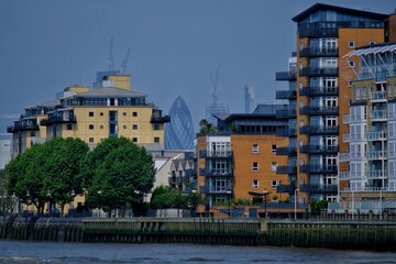 View of residential buildings in Greenwich and the Gherkin tower in the background