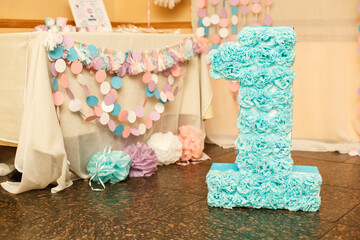 Birthday party for child one years old. Pink, mint and white colors. Stylish Birthday decorations and big number one