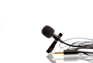 Small lavalier microphone or lapel mic with clip and adapter for computer