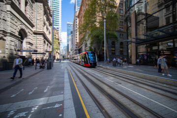 Tram moving through George St and Kent St in Sydney NSW Australia
