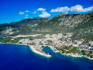 Obraz premium The top view from the drone of Kas resorts and city with amazing blue and clear lagoon and yachts in Mugla province of Turkey