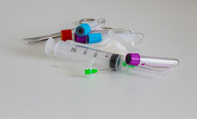Various types of test tubes for blood collection with syringe and needle. Science working for health at the time of the coronavirus pandemic, covid-19