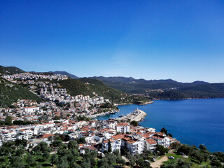 Obraz premium The top view from the drone of Kas resorts and city with amazing blue and clear lagoon and yachts in Mugla province of Turkey