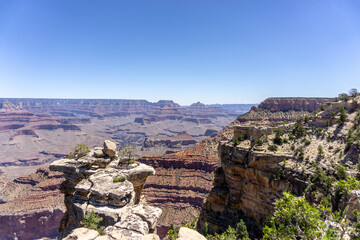 Clear skies and The Grand Canyon. that is a huge valley cut by the Colorado River.