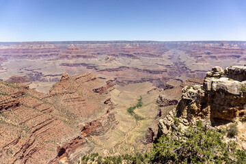 Clear skies and The Grand Canyon. that is a huge valley cut by the Colorado River.