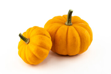 pair of pumpkins mini symbol of autumn and halloween faces on a white isolated background