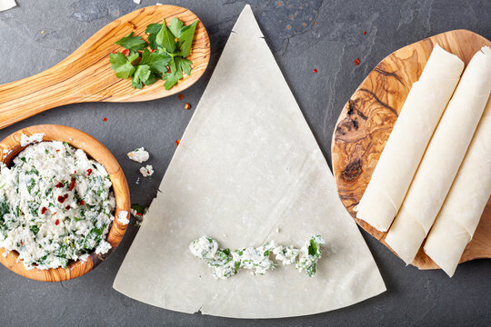 Ingredients and preparation of traditional turkish phyllo dough rolls (Sigara boregi) A deep fried cheese or meat rolls popular in Turkey