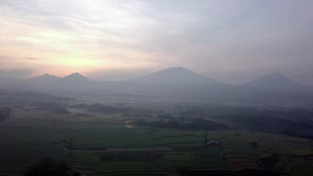 The atmosphere at sunrise over the countryside with Mt. Merapi, Mt. Merbabu, Mt. Andong and Mt. Telomoyo background