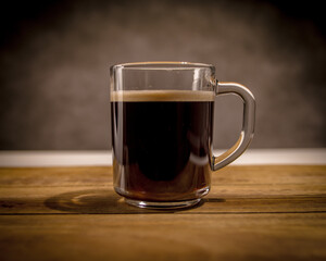 Freshly brewed cup of coffee on a wooden table - studio photography