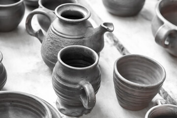 crockery beer mug and bowl tinted set on a wooden table