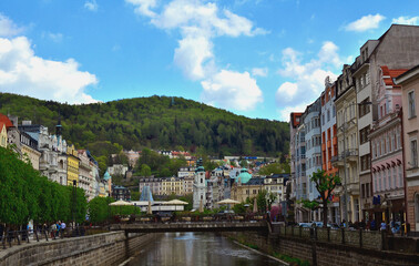Fototapeta na wymiar View along River Tepla toward St Mary Magdalene Church in Karlovy Vary, Czechia