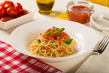 Spaghetti with tomato sauce and basil.