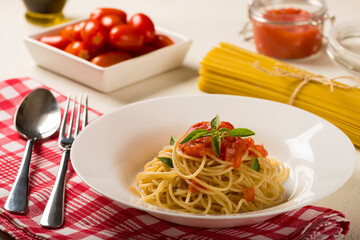 Spaghetti with tomato sauce and basil.