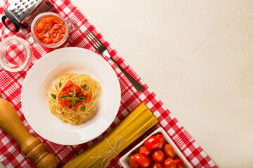 Spaghetti with tomato sauce and basil.