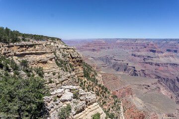 Clear skies and The Grand Canyon. that is a huge valley cut by the Colorado River.