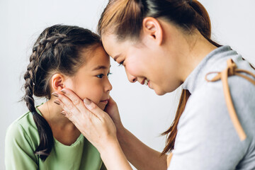 Portrait of enjoy happy love asian family mother and little asian girls child smiling and having fun play with cute kid daughter moments good time