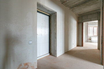 interior of the apartment without decoration in gray colors. rough finish