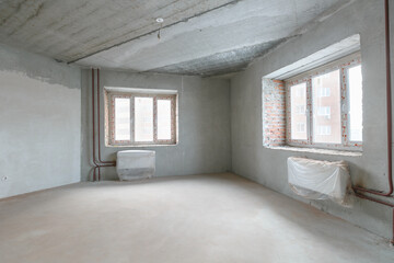 interior of the apartment without decoration in gray colors. rough finish