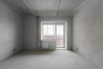 interior of the apartment without decoration in gray colors. rough finish