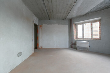 interior of the apartment without decoration in gray colors. rough finish