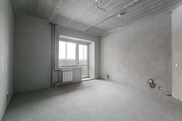interior of the apartment without decoration in gray colors. rough finish